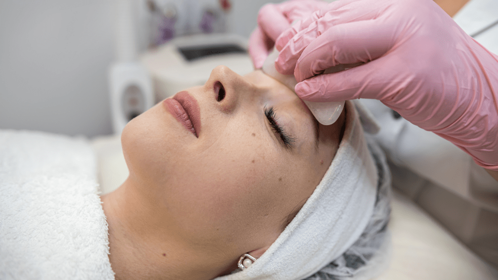 Woman at clinic applying facial medicine